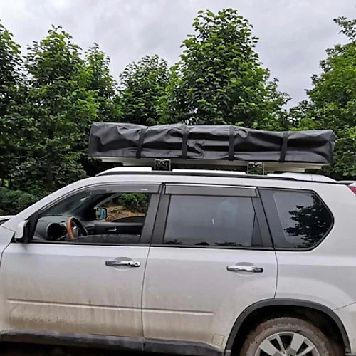 Dog House Mesa rooftop tent closed on SUV roof rack for camping travel