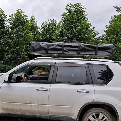 Dog House Mesa rooftop tent closed on SUV roof rack for camping travel