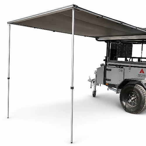 Dog House roof mounted awning open beside trailer with aluminum support poles