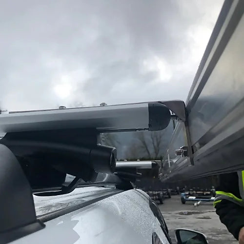 Dog House SUV awning mounted to roof rack with bracket hardware