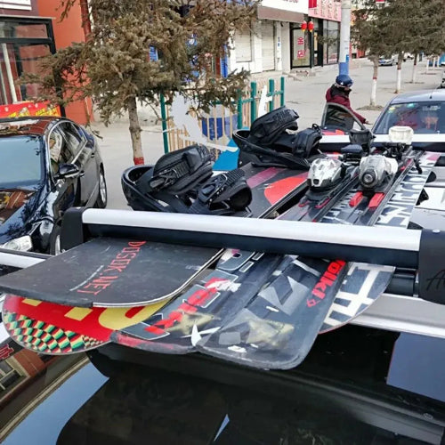Full-Pull AO Extender ski and snowboard carrier holding multiple skis and snowboards on a vehicle roof rack for winter travel