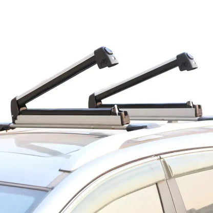 Side view of Full-Pull AO Extender slide-out ski snowboard rack mounted to roof crossbars, showing raised arm clearance and compact profile