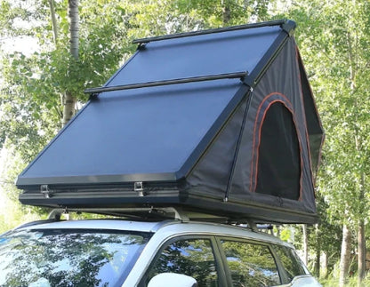 Galaxy Clamshell Rooftop Tent mounted on SUV roof, partially opened for setup