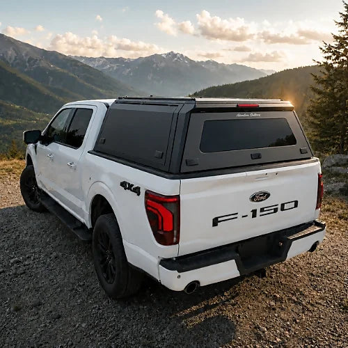GullWing aluminum truck cap with tinted rear glass and lockable side doors on an overland pickup truck