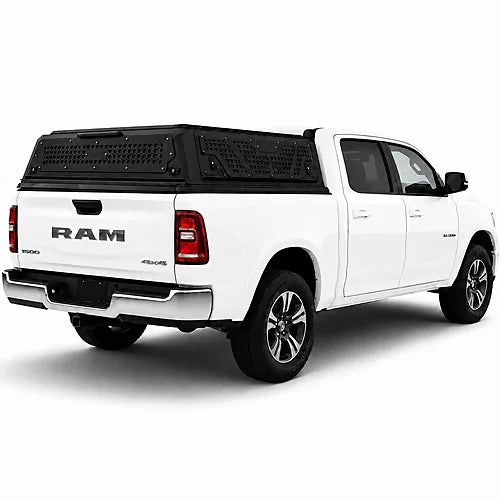White Ram truck with a black low profile truck topper on a white background