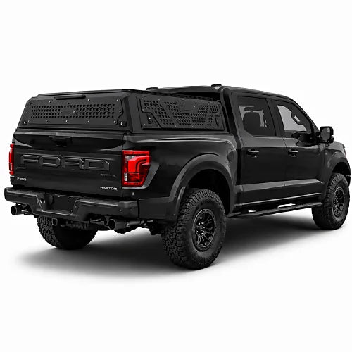 Black Ford F-150 Raptor truck with a low profile canopy on a white background