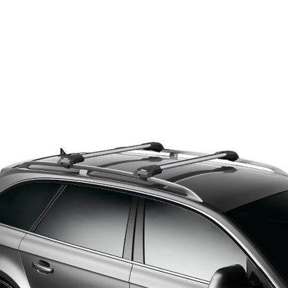 Thule AeroBlade Edge Raised Rail roof rack system installed on vehicle for cargo transport