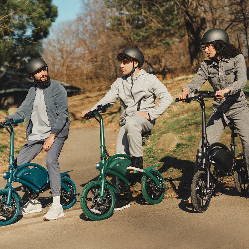 Group of riders on Jetson Bolt Pro Foldable E-Bikes enjoying a park ride, showcasing compact electric bike design and portability