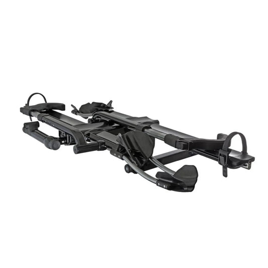 Angled front view of the Kuat NV 2.0 hitch bike rack showing trays and arm supports.


