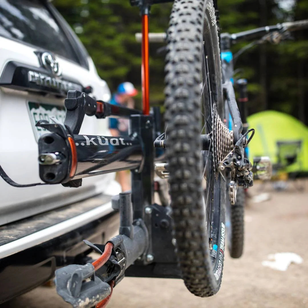 Zoomed-in view of front tire mounted securely in the rack arm hook.