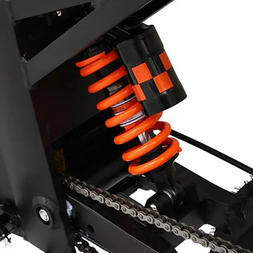 Close-up of rear nitrogen shock absorber and chain system on Kugoo Wish 01