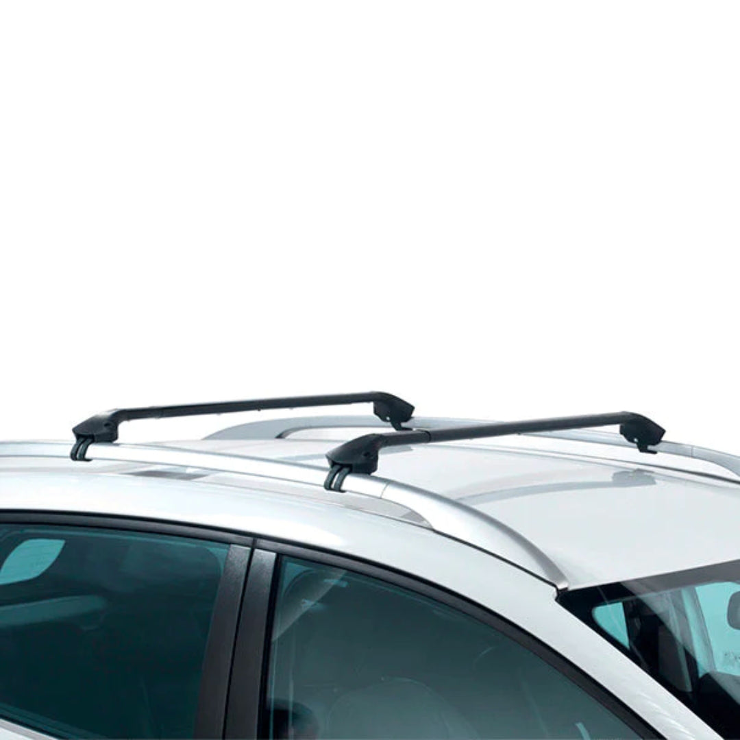 Crossbars installed on a silver car roof for a sleek, low-profile fit.