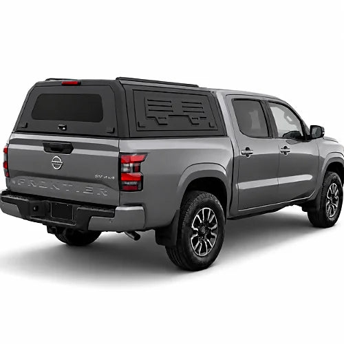 GullWing aluminum truck cap with tinted rear glass and lockable side doors on an overland pickup truck