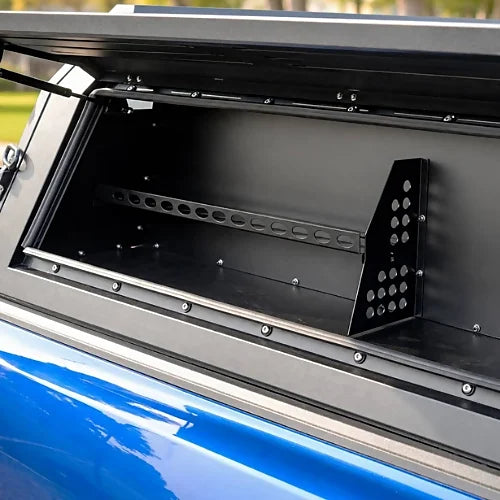 Interior view of aluminum truck cap with open gullwing side door and gear mounting rail
