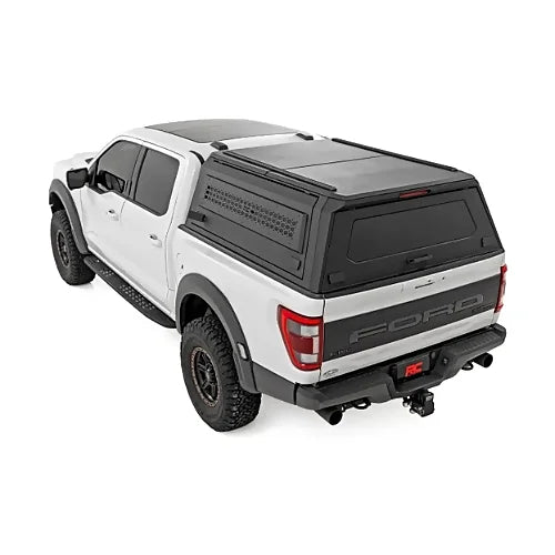 Rough Country modular bed cap canopy mounted on Ford F-150 pickup for overland gear storage