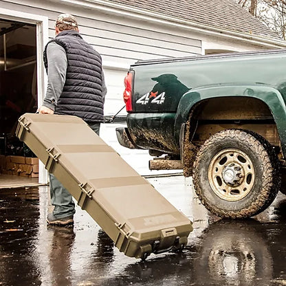 Pelican V800E Vault Case being rolled to a truck in a garage setting