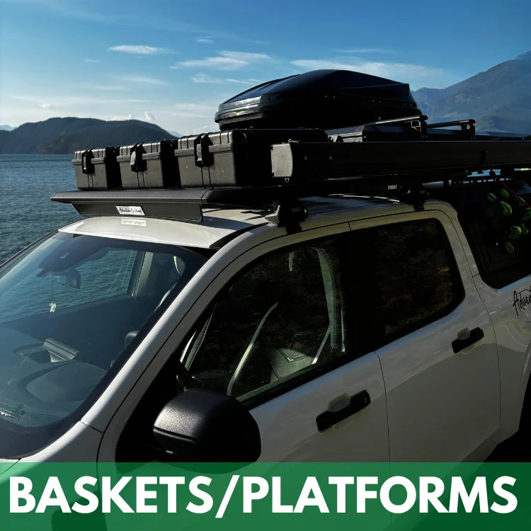 hybrid truck with roof-mounted cargo basket and platform for rent near a body of water with mountains in the background.