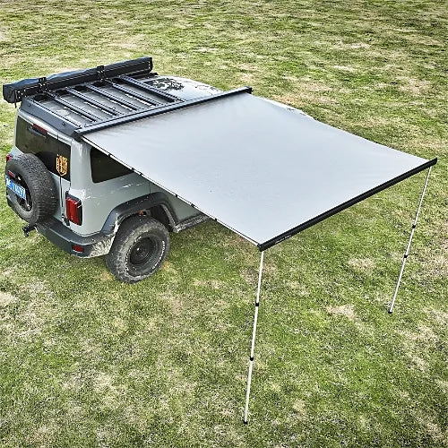 ReTract AO Auto Retractable Awning fully extended beside off-road vehicle for sun and weather protection