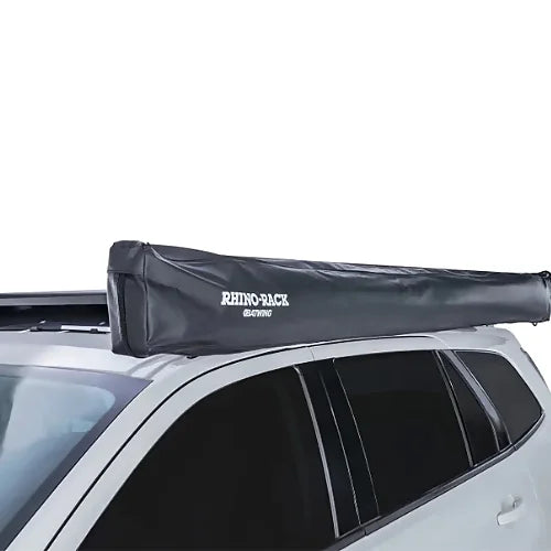Close-up of Rhino-Rack Batwing Awning storage bag secured to roof