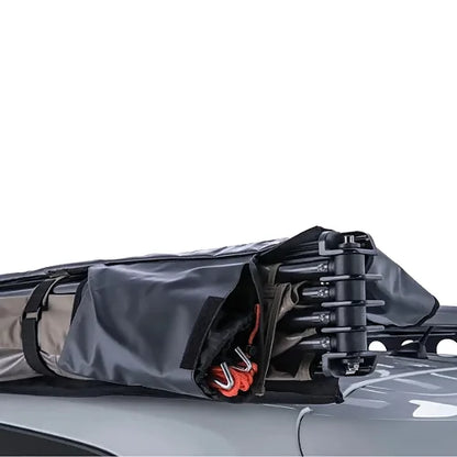 Awning frame and accessories folded into storage position on roof