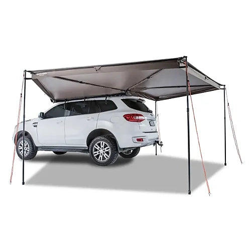 Fully deployed Batwing Awning providing 270° shade around SUV