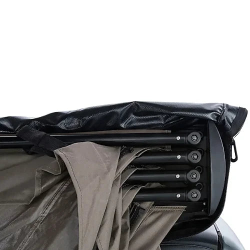 Rhino-Rack Batwing Awning fully opened on a rooftop rack - driver side