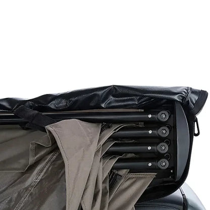 Rhino-Rack Batwing Awning fully opened on a rooftop rack - driver side
