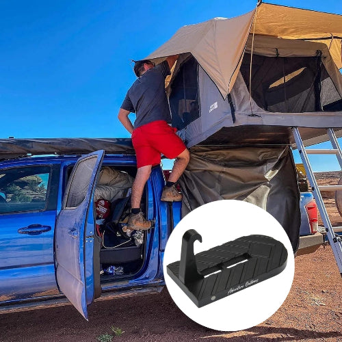Rhino-Rack Masterfit Cargo Box mounted on vehicle in rugged camping setup with roof top tent