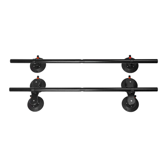 Two black SeaSucker Monkey Bars with vacuum mounts aligned for rooftop installation.
