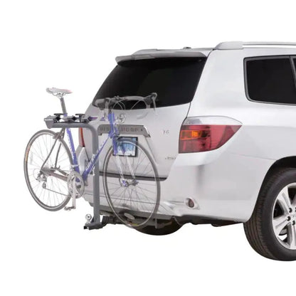 SportRack Pathway bike carrier mounted on SUV with two bikes attached.

