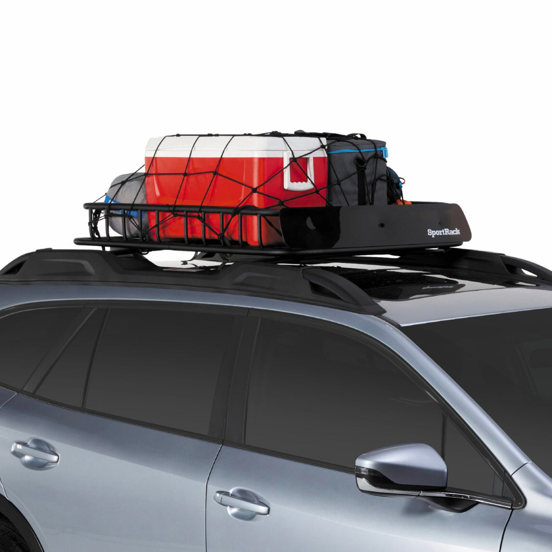 Low angle view of Vista Roof Basket filled with travel and camping gear on SUV.