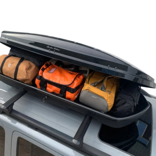 Stream AO roof cargo box side profile showing low-profile aerodynamic roof box design for rooftop storage