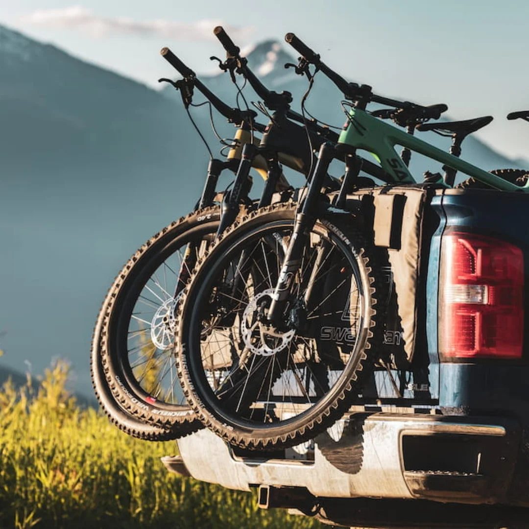 Swagman Paramount Tailgate Pad on the back of a blue truck with 3 bicycles loaded