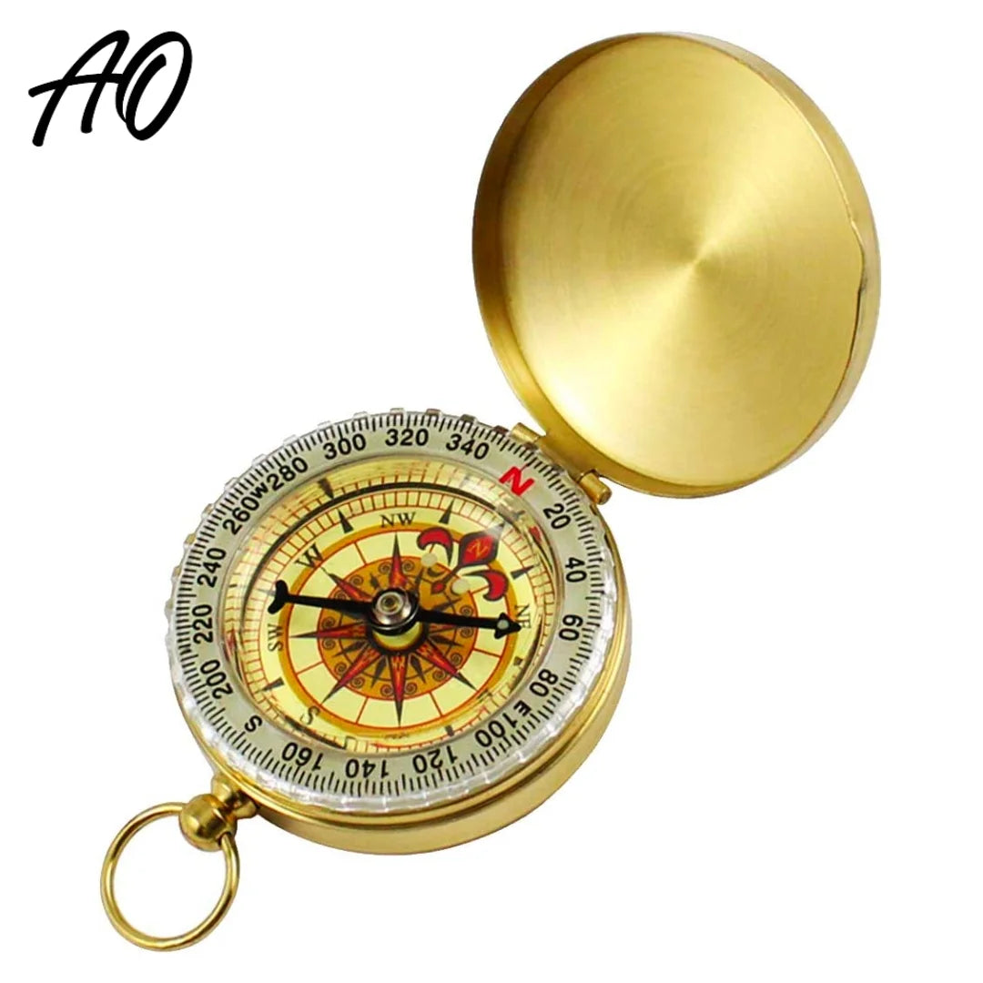 AO brass tactical compass with lid open showing detailed directional dial and keyring.

