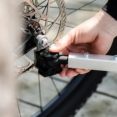 Close-up of Thule Bexey dog trailer quick-attach hitch system for secure and easy bike connection