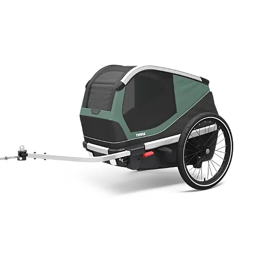 Thule Bexey dog bike trailer in hazy green, side angle view showing durable frame and mesh ventilation panels for pet comfort