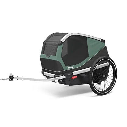 Thule Bexey dog bike trailer in hazy green, side angle view showing durable frame and mesh ventilation panels for pet comfort