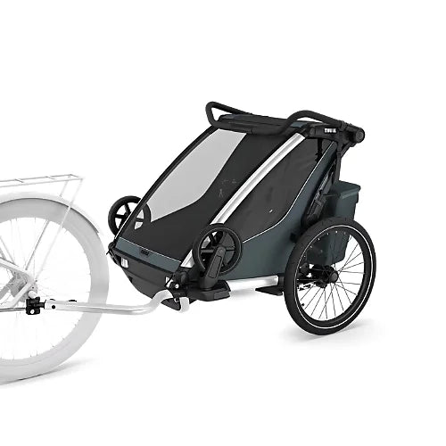 Thule Chariot Cross 2 Double in Dark Slate color attached to a bicycle for family cycling and commuting use