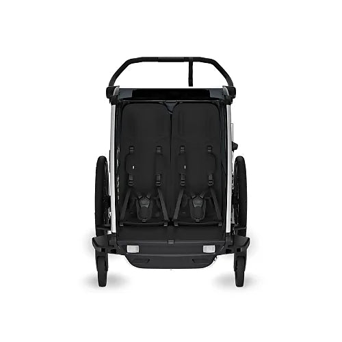 Interior of Thule Chariot Cross 2 Double trailer showing two padded seats and 5-point harness system