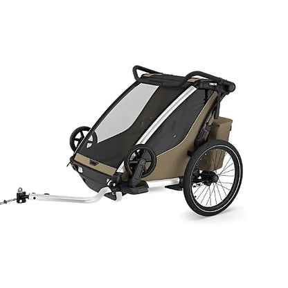 Thule Chariot Cross 2 Double Faded Khaki multisport bike trailer for two children attached to a bicycle