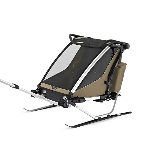 Thule Chariot Cross 2 Double Faded Khaki multisport trailer equipped with ski kit for winter adventures and snow travel