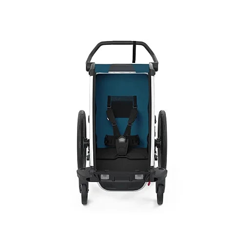 Front-facing view of Thule Chariot Cross Single Majolica Blue showing padded seat and secure 5-point harness for comfort and safety