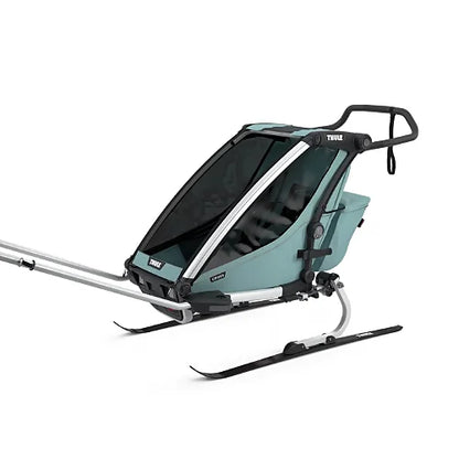 Thule Chariot Cross Single attached to cross-country ski kit setup for winter activity