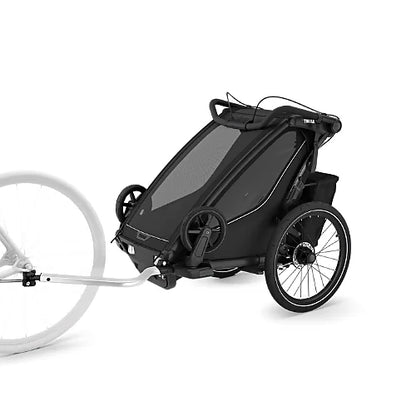 Thule Chariot Sport 2 single bike trailer and stroller in black shown in cycling mode with aerodynamic frame and large wheels