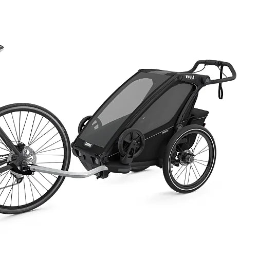 Thule Chariot Sport Single bike trailer connected to bicycle with tow arm and safety strap