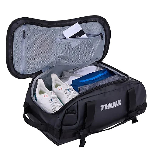 Interior view of Thule Chasm 30L black duffel bag featuring internal mesh organizer pockets