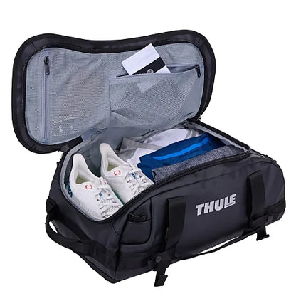 Interior view of Thule Chasm 30L black duffel bag featuring internal mesh organizer pockets