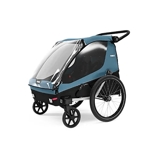 Thule Courier in stroller mode with clear rain cover and swivel wheels