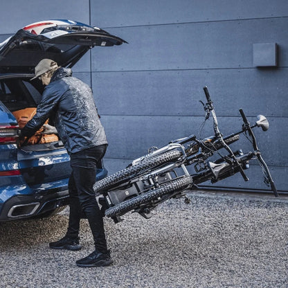 Thule EasyFold XT bike rack tilt feature allows trunk access with bikes mounted on SUV