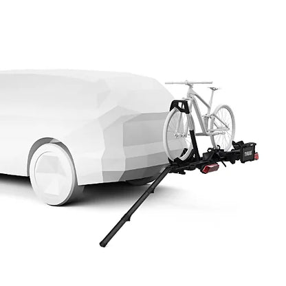 Ramp attached to hitch rack with white bike being loaded